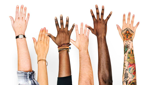 diversity-hands-raised-up-gesture-PRJCKBR
