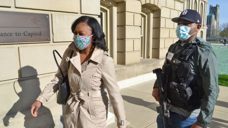 Armed black citizens escort Michigan Rep. to capitol as security detail