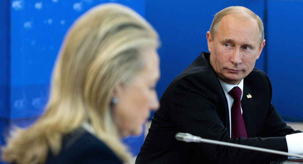 Russian President Vladimir Putin gazing away as then Secretary of State Hillary R. Clinton addresses a question.